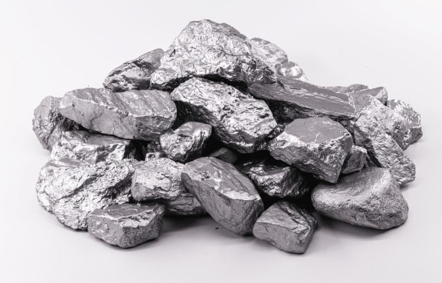 A pile of molybdenum ore sitting in a white background