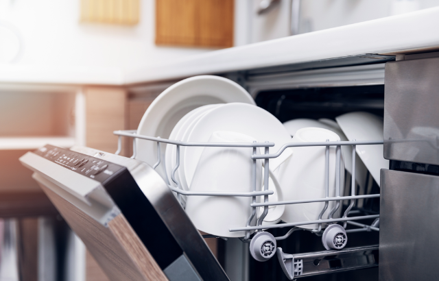 Dishes loaded into a dishwasher